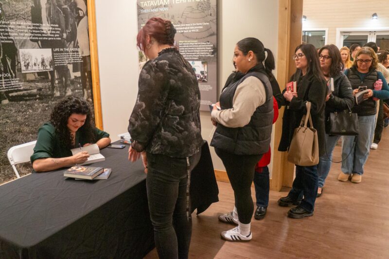 A line of avid readers forms as they wait to get their books signed by featured One Story, One City author Zoraida Córdova on March 1, 2025 at the Mitchell River House in Canyon Country, Calif. Katherine Quezada/The Signal