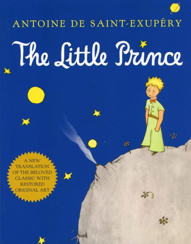 Cover of The Little Prince by Antoine de Saint-Exupéry, showing the prince standing on a small planet with stars in the dark blue sky and golden text accents.